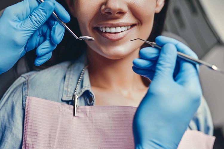 Dentist Inspecting Teeth