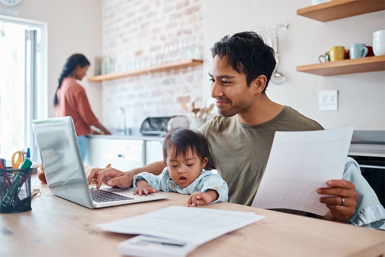 parents-with-laptop-and-baby