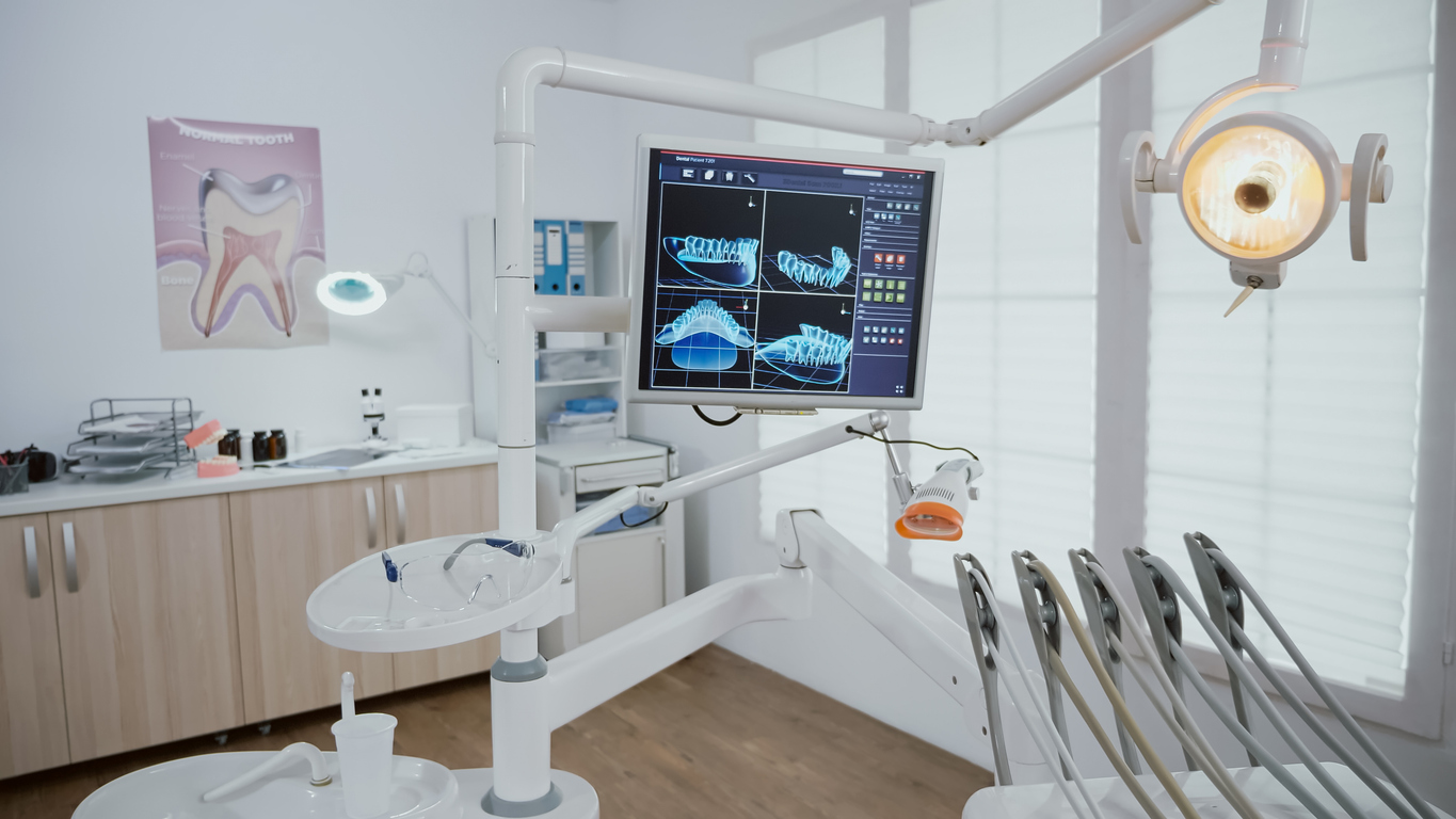 Empty stomatology orthodontic office room equipped with professional dentistry tools Empty stomatology orthodontic office room equipped with professional dentistry tools